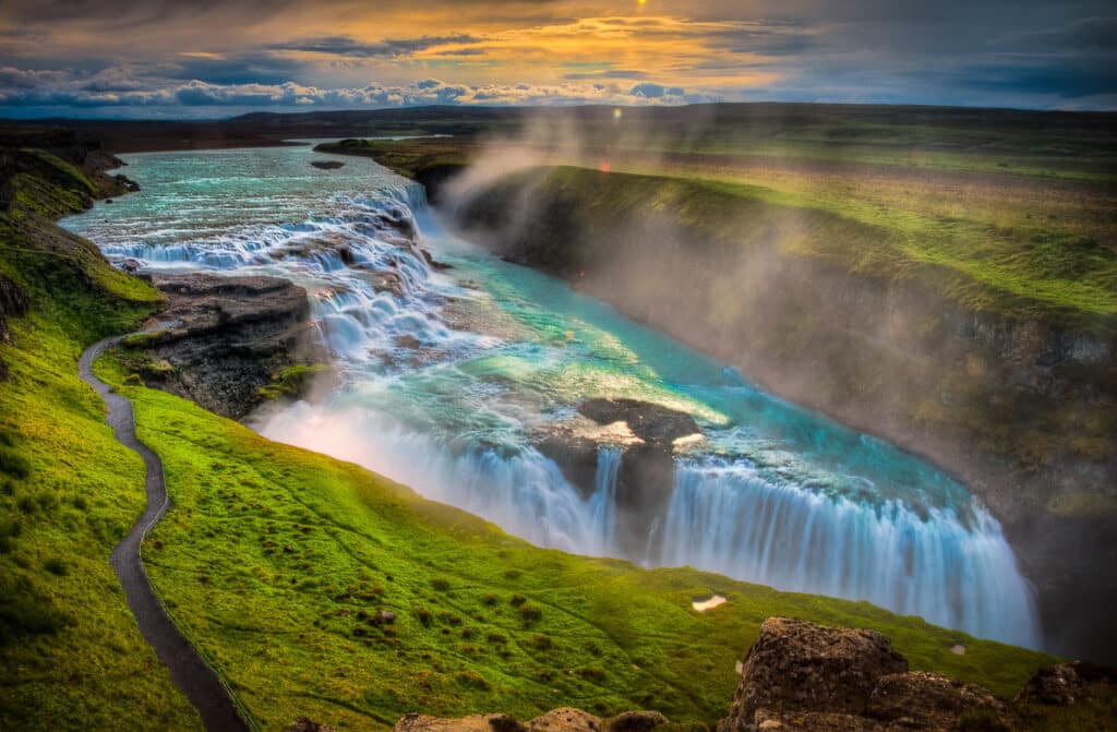 Gullfoss delights with two right-angle waterfalls and clouds of mist. Gullfoss is in southwestern Iceland.