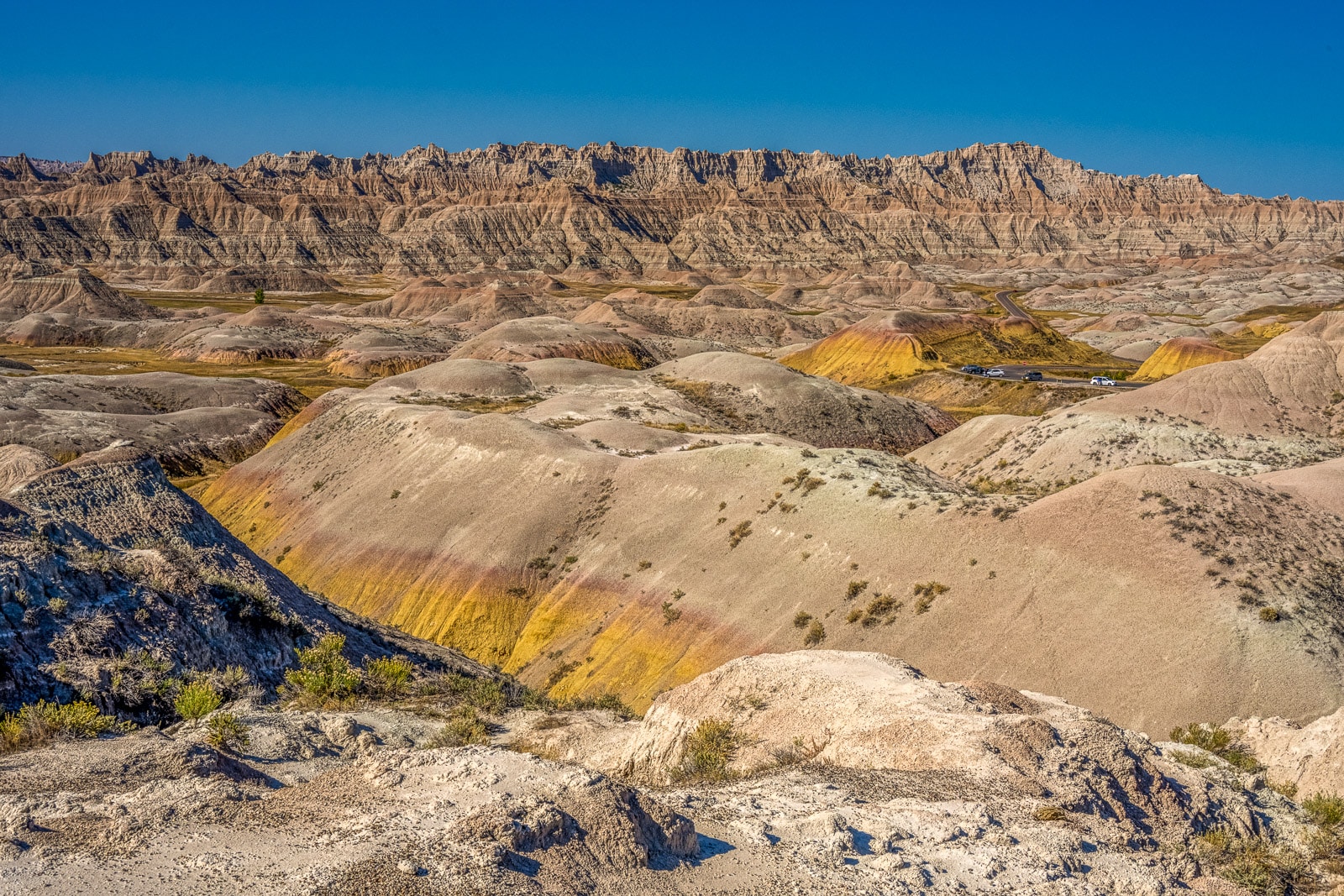 A view of the Yellow Mounds Formation from Yellow Mounds Overlook in Badlands National Park, South Dakota. This yellow formation is the topmost layer of the Pierre Shale (the base formation of the badlands strata). the yellow color is do to chemicals from ancient decaying plants coloring the paleosol.