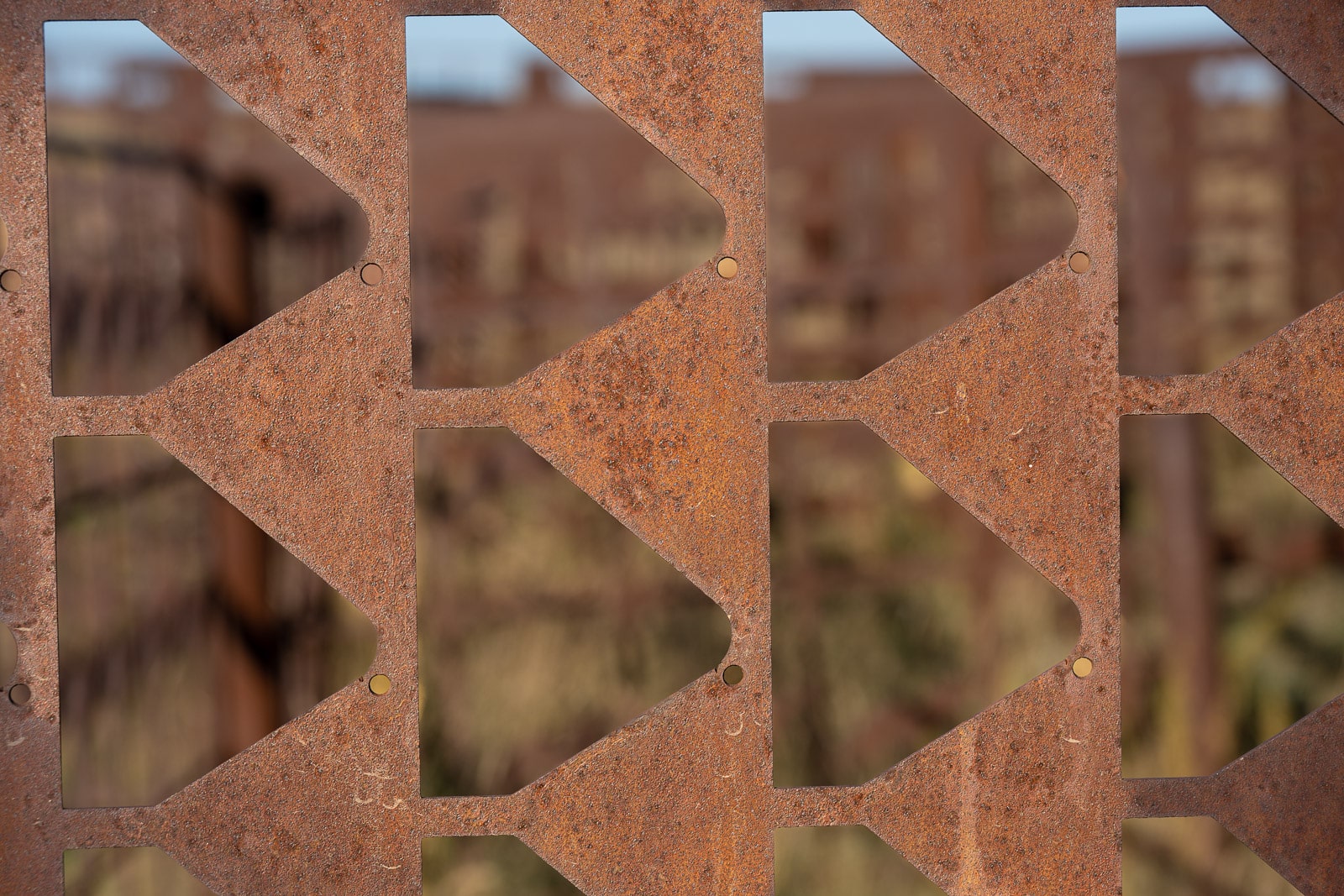 This is a closeup of part of a maze constructed of sections of iron fence. It is adjacent to Grasshoppers in the Field, along the Enchanted Highway between I-94 and Regent, North Dakota.