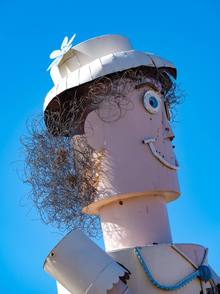 This is a closeup of the head of the mother figure in the sculpture by Gary Greff called The tin Family. Notice the baling wire used as hair. This sculpture is along the Enchanted Highway between I-94 and Regent, North Dakota.