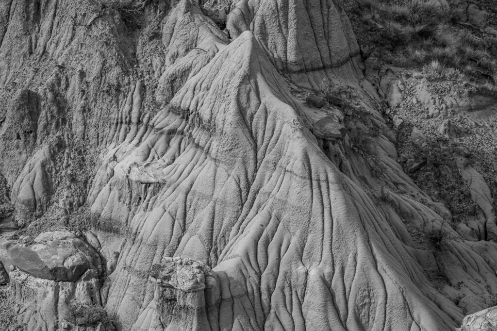 Black and White closeup of rock formations and concretions in the badlands of Makoshika State Park near Glendive, Montana.