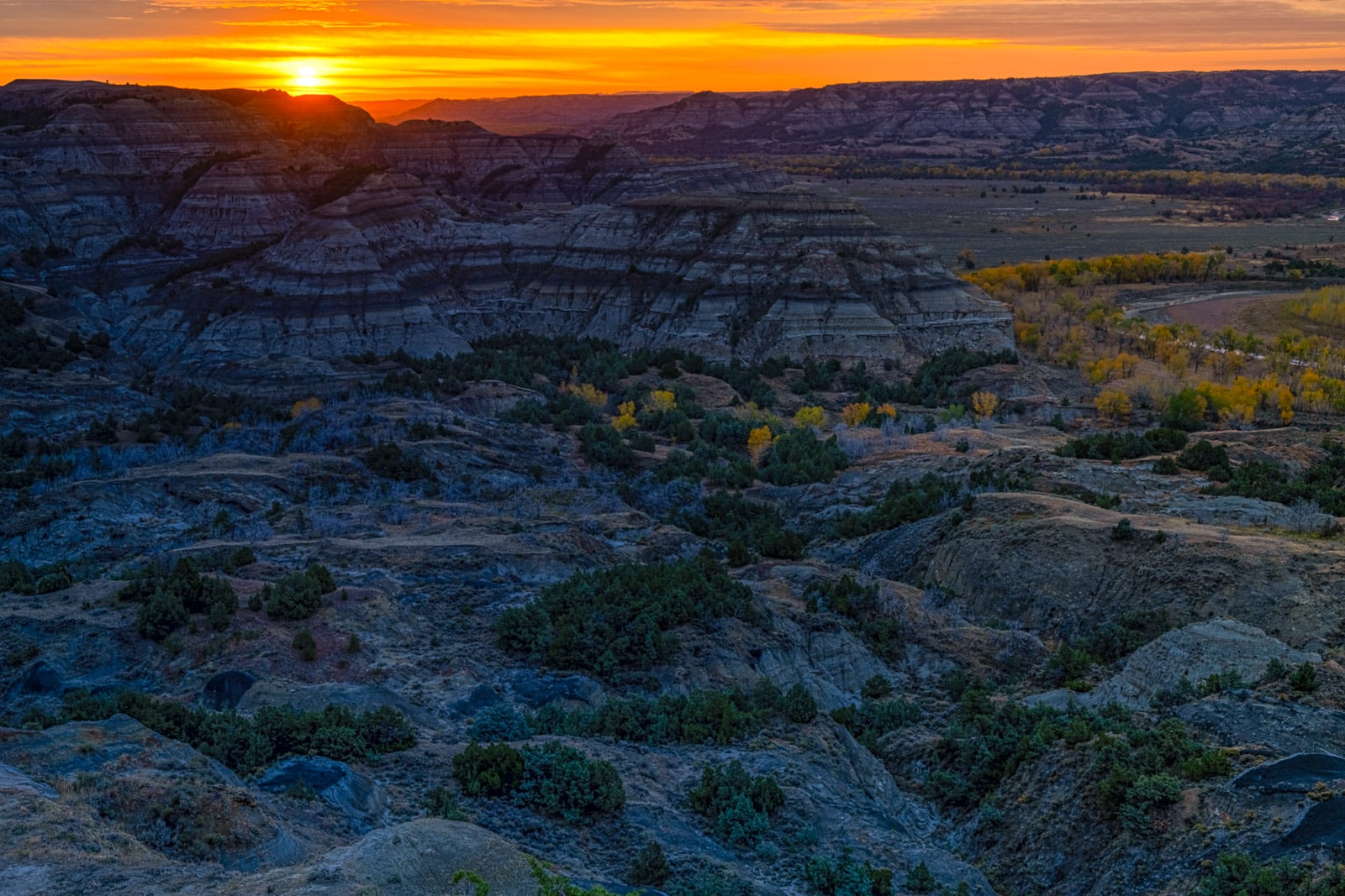 Sunset looking across the badlands to the Little Missouri River in the North Unit of Theodore Roosevelt National Park in North Dakota.