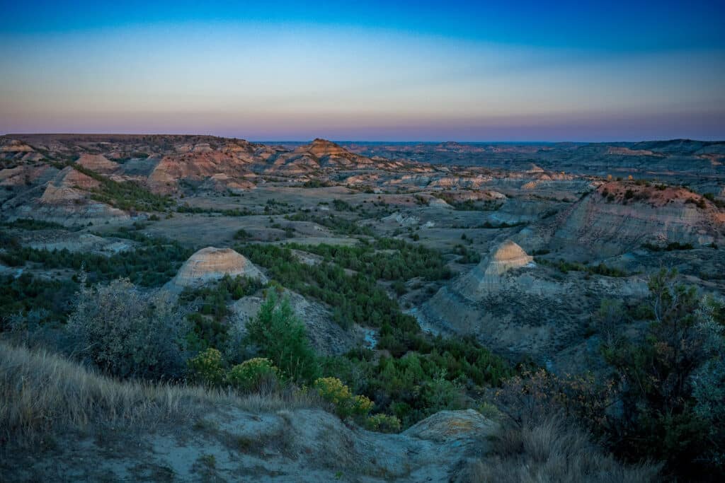 Dawn view of badlands taken from the overlook at the Painted Canyon Visitor's Center at Theodore Roosevelt National Park near Medora, North Dakota.