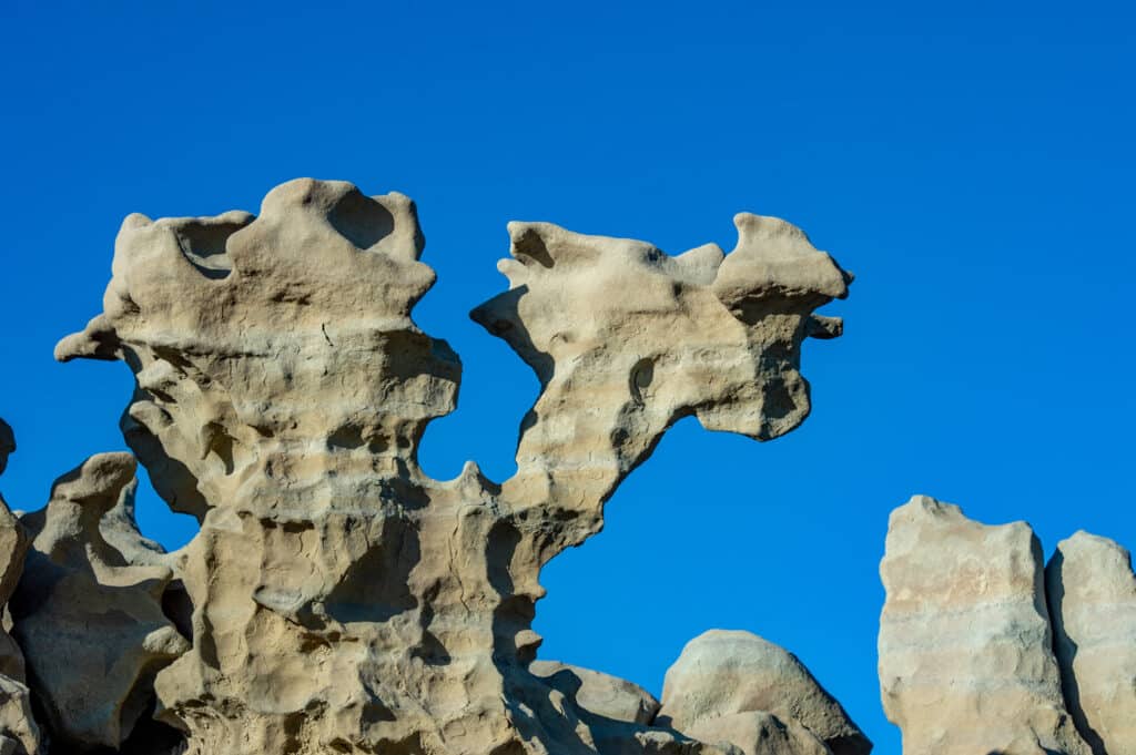 Fanciful figure naturally sculpted in the sandstone of Fantasy Canyon, south of Vernal, Utah. It looks a little like a flying witch.