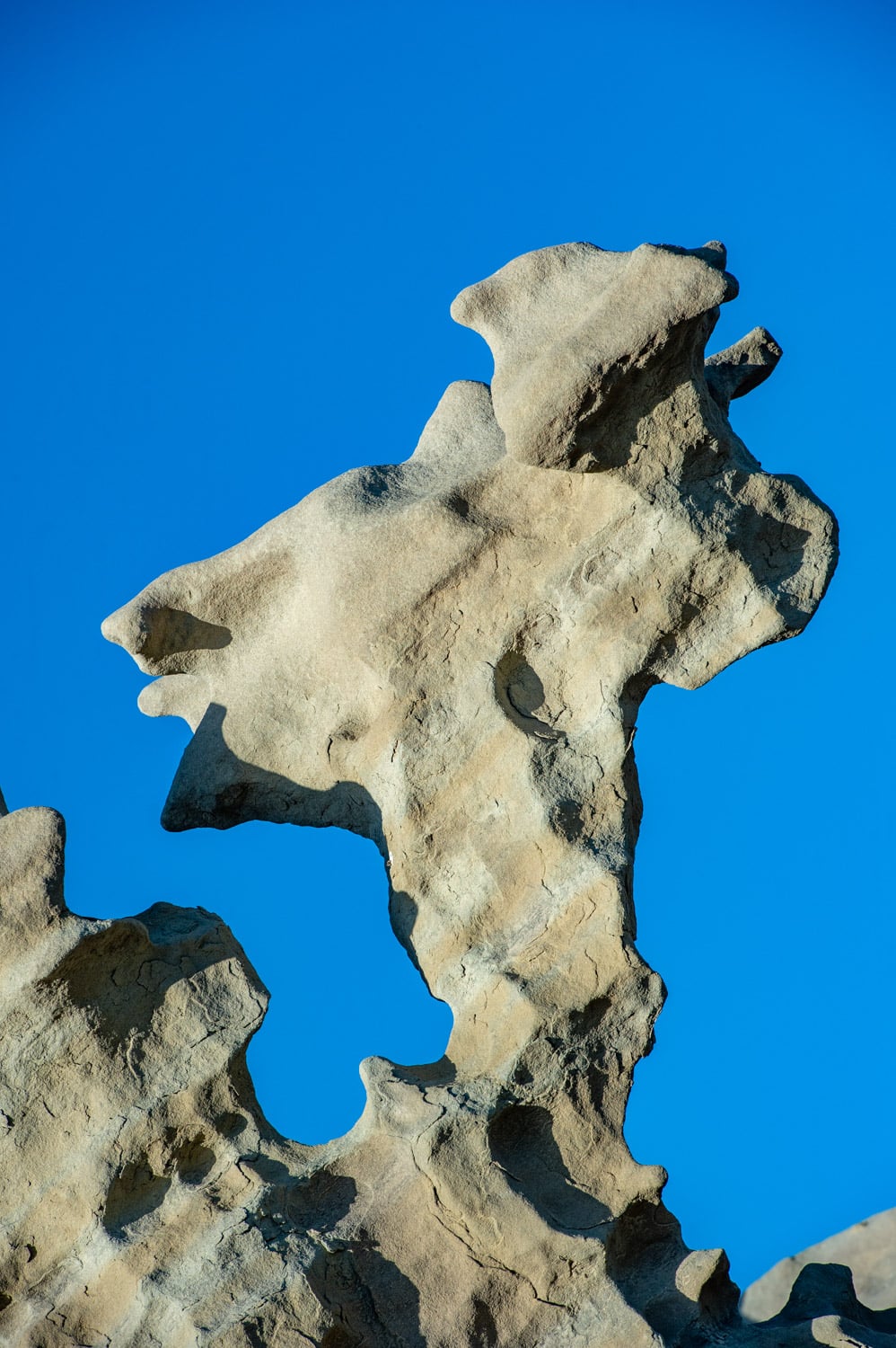 Fanciful figure naturally sculpted in the sandstone of Fantasy Canyon, south of Vernal, Utah. It looks a little like a flying witch.