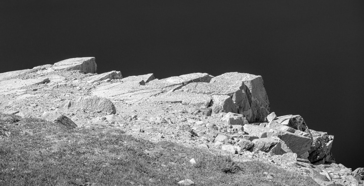 A black and white abstract showing a rocky edge along the Beartooth Highway.