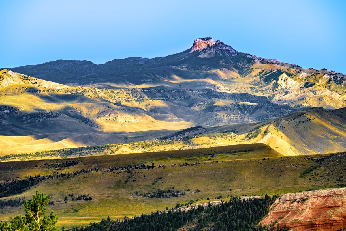 Afternoon view of Heart Mountain taken from Chief Joseph Scenic Byway, near Cody, Wyoming. Triassic beds of the Chugwater Formation are visible in the foreground.